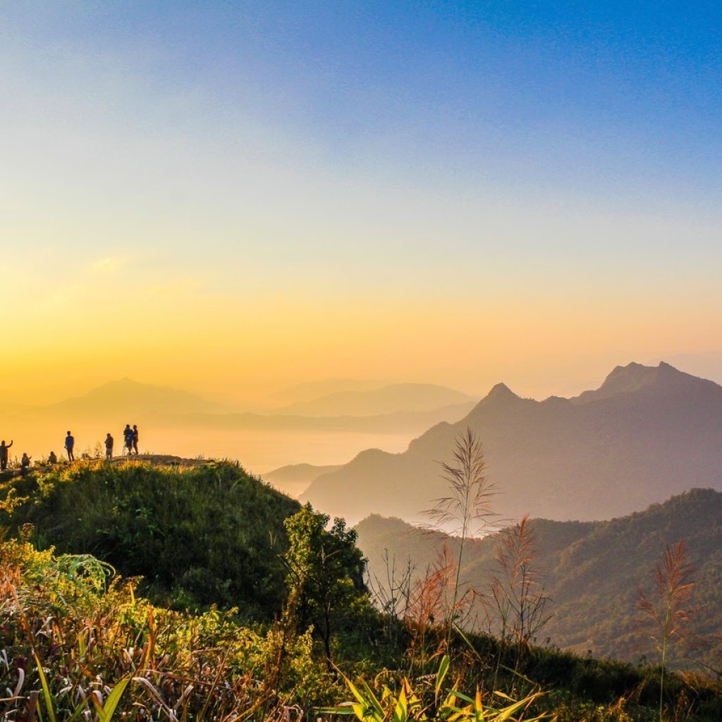 photo of people standing on top of mountain near grasses 733162.jpg